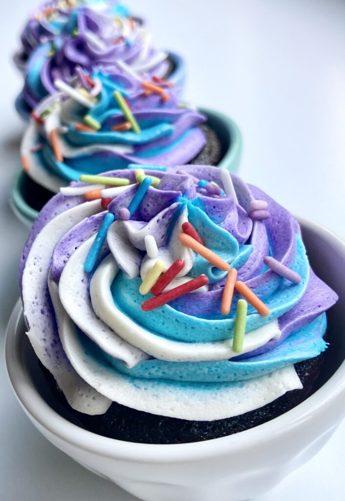 Multi colored frosted cupcakes