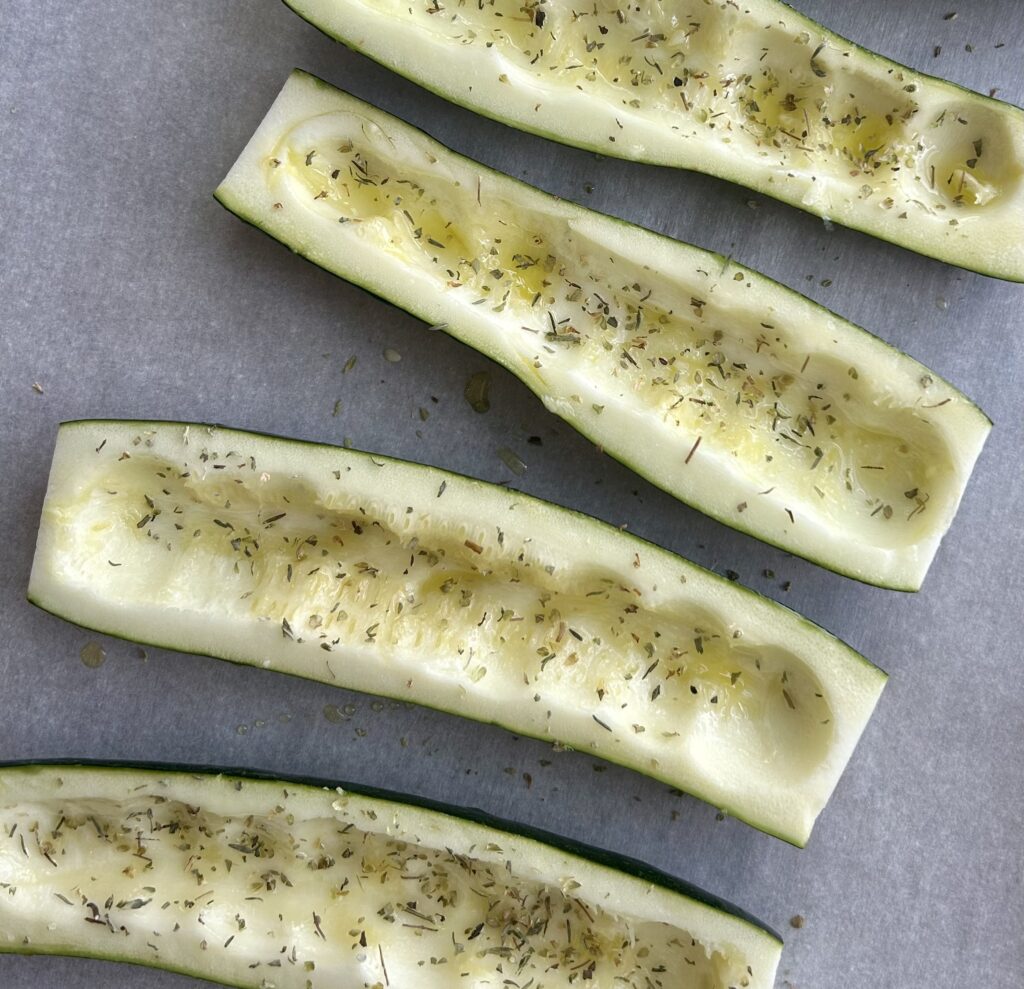 zucchini, cut in half, brushed with olive oil and sprinkled with seasoning