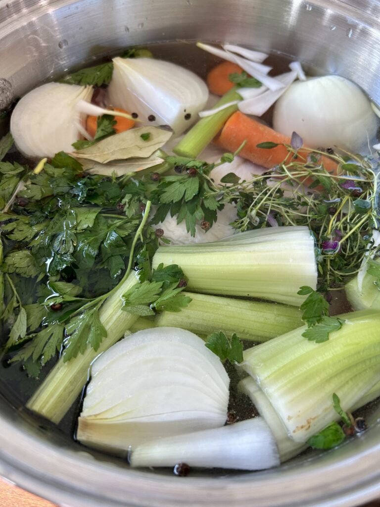 chicken broth before it's cooked