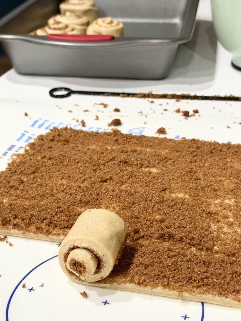 rolling up cinnamon rolls