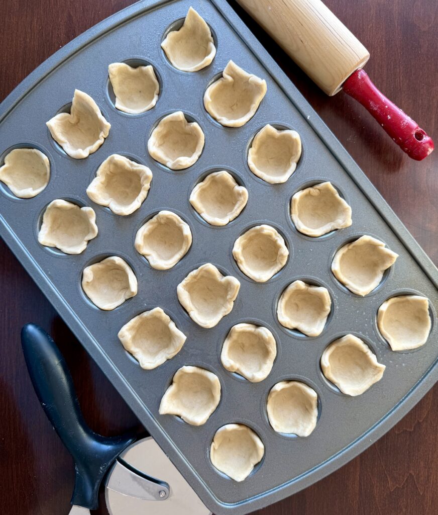 crescent roll dough in mini muffin cups