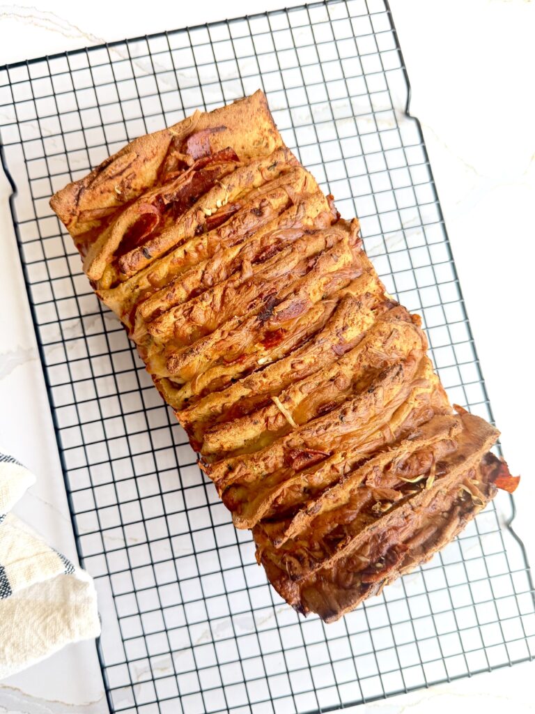 Pizza bread with cheesy layers of cheese and pepperoni, made with freshly milled flour